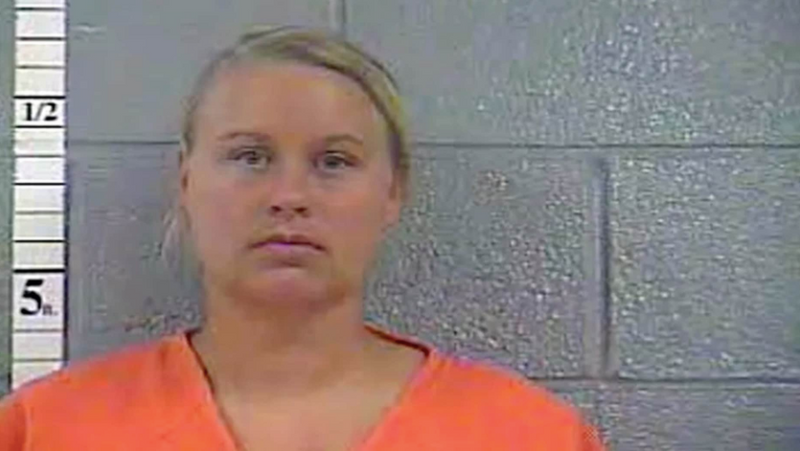 Kentucky woman arrested for allegedly leaving kids in car with loaded guns to get tan.